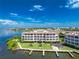 Luxury condo building with waterfront access and lush landscaping at 11100 Hacienda Del Mar Blvd # 202, Placida, FL 33946