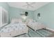 Guest bedroom with two twin beds, light wood floors, and coastal decor at 11100 Hacienda Del Mar Blvd # 202, Placida, FL 33946