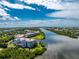 Luxury condo building with waterfront access and beautiful landscaping at 11100 Hacienda Del Mar Blvd # 202, Placida, FL 33946
