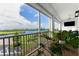 Enjoy water views from this screened balcony, complete with seating and a ceiling fan at 11100 Hacienda Del Mar Blvd # 202, Placida, FL 33946
