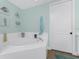 Spa-like bathroom with a large, round bathtub, and a teal color scheme at 11100 Hacienda Del Mar Blvd # 202, Placida, FL 33946