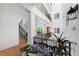 Bright interior hallway with bench and natural light at 11100 Hacienda Del Mar Blvd # 202, Placida, FL 33946
