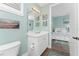 Bathroom with a vanity, toilet and view into bedroom at 11100 Hacienda Del Mar Blvd # 202, Placida, FL 33946