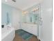 Bathroom with double vanity, tub, and shower at 11100 Hacienda Del Mar Blvd # 202, Placida, FL 33946