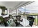 Screened balcony with seating area offering scenic views of the waterway and community at 11100 Hacienda Del Mar Blvd # 202, Placida, FL 33946