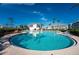 Large, kidney-shaped pool surrounded by a spacious patio at 11100 Hacienda Del Mar Blvd # 202, Placida, FL 33946