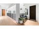 Interior hallway with wooden bench and access to unit at 11100 Hacienda Del Mar Blvd # 202, Placida, FL 33946