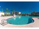 Resort-style pool with plenty of lounge chairs and umbrellas at 11100 Hacienda Del Mar Blvd # 202, Placida, FL 33946