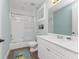 Clean bathroom with a shower/tub combo and white tile at 11100 Hacienda Del Mar Blvd # 202, Placida, FL 33946
