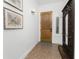 Entryway with wooden door and coat rack at 11100 Hacienda Del Mar Blvd # 202, Placida, FL 33946