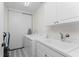 Well-equipped laundry room with washer, dryer, and utility sink at 11100 Hacienda Del Mar Blvd # 202, Placida, FL 33946