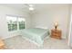 Bedroom with a queen-size bed and a view of a pond at 8403 Placida Rd # 303, Placida, FL 33946