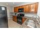 Kitchen with granite countertops and wooden cabinets at 8403 Placida Rd # 303, Placida, FL 33946