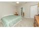 Main bedroom with a king-size bed, dresser, and ensuite bathroom access at 8403 Placida Rd # 303, Placida, FL 33946