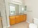 Double vanity bathroom with granite countertop and shower at 8403 Placida Rd # 303, Placida, FL 33946