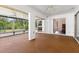 Spacious screened porch with ceiling fans and access to backyard at 7506 Spinnaker Blvd, Englewood, FL 34224