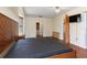Bright bedroom featuring wood floors and a ceiling fan at 7506 Spinnaker Blvd, Englewood, FL 34224