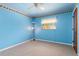 Light blue bedroom with carpet and ceiling fan at 7506 Spinnaker Blvd, Englewood, FL 34224