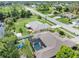 Aerial view of canal-front home with pool and backyard at 7506 Spinnaker Blvd, Englewood, FL 34224