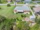 Aerial view of house, backyard with shed and fire pit at 7506 Spinnaker Blvd, Englewood, FL 34224