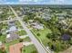 Residential neighborhood with numerous houses and lush landscaping at 7506 Spinnaker Blvd, Englewood, FL 34224
