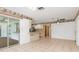 Kitchen with ample counter space, stainless steel appliances, and view to dining area at 7506 Spinnaker Blvd, Englewood, FL 34224