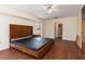 Spacious bedroom with wood flooring and large window at 7506 Spinnaker Blvd, Englewood, FL 34224