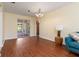 Bright dining room features wood floors and access to a sunroom at 7506 Spinnaker Blvd, Englewood, FL 34224