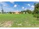 House with large grassy yard, providing ample outdoor space at 7506 Spinnaker Blvd, Englewood, FL 34224