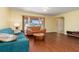 Living room with hardwood floors, couches, and coffee table at 7506 Spinnaker Blvd, Englewood, FL 34224