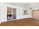 Enclosed porch with sliding glass doors, leading to the backyard at 7506 Spinnaker Blvd, Englewood, FL 34224