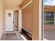 Screened porch entry with white door and view of patio at 7506 Spinnaker Blvd, Englewood, FL 34224