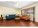 Living room with hardwood floors and large windows at 7506 Spinnaker Blvd, Englewood, FL 34224