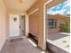 Screened porch entry with white door and adjacent patio at 7506 Spinnaker Blvd, Englewood, FL 34224