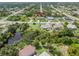 Aerial showing home, neighborhood, and surrounding landscape at 7506 Spinnaker Blvd, Englewood, FL 34224