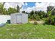 Metal storage shed in the backyard, providing extra space at 7506 Spinnaker Blvd, Englewood, FL 34224