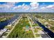 Property aerial view showcasing canal front location and neighborhood at 15507 Aqua Cir, Port Charlotte, FL 33981
