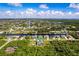 Property aerial view showcasing canal front location and neighborhood at 15507 Aqua Cir, Port Charlotte, FL 33981