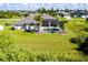Aerial view of a house with a pool and large backyard at 15507 Aqua Cir, Port Charlotte, FL 33981