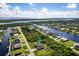 Property aerial view showcasing canal front location and neighborhood at 15507 Aqua Cir, Port Charlotte, FL 33981