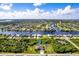 Property aerial view showcasing canal front location and neighborhood at 15507 Aqua Cir, Port Charlotte, FL 33981