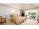 Spacious Primary bedroom with ensuite bathroom access and backyard views at 15507 Aqua Cir, Port Charlotte, FL 33981