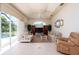 Relaxing Gathering room with pool view and sliding glass doors at 15507 Aqua Cir, Port Charlotte, FL 33981
