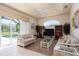 Gathering room features comfortable seating and access to the pool at 15507 Aqua Cir, Port Charlotte, FL 33981