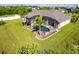 Aerial view of a single-Gathering home with a pool and large backyard at 15507 Aqua Cir, Port Charlotte, FL 33981