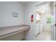 Laundry room with washer, dryer, and built-in counter at 15507 Aqua Cir, Port Charlotte, FL 33981