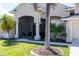 Enclosed porch with seating area, adjacent to the front entrance at 15507 Aqua Cir, Port Charlotte, FL 33981