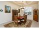 Elegant dining room featuring a wood table, chairs, and hutch at 15507 Aqua Cir, Port Charlotte, FL 33981
