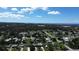 Wide aerial view of houses near the coast on a sunny day at 317 E Green St, Englewood, FL 34223