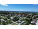 Wide aerial view of houses near the coast on a sunny day at 317 E Green St, Englewood, FL 34223